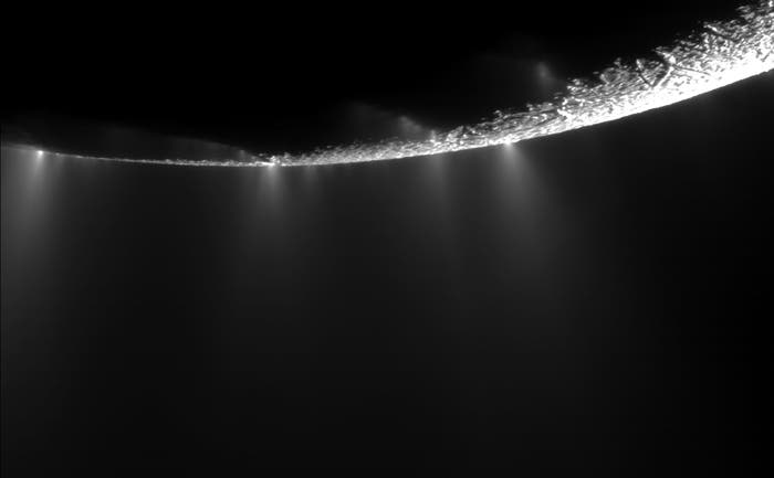 saturn_moon_2 Plumes springing from Enceladus' surface spray water ice out from many locations along the “tiger stripes” near the moon's south pole. (c) NASA/JPL/SSI