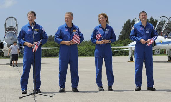 atlantis_crew Joining Ferguson (left in photo) for the 12-day STS-135 mission to the International Space Station are pilot Doug Hurley (second left), and mission specialists Sandy Magnus and Rex Walheim. (c) NASA