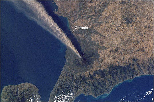 Mt. Etna gushing plume from an eruption in 2001, as seen from an image captured in space by the International Space Station. (c) NASA