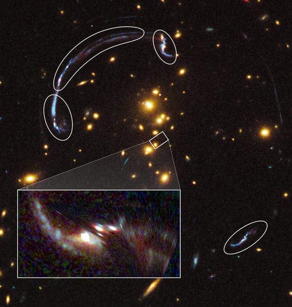 brightest-galaxy-gravity-lens The zoom in rectangle shows the brightest galaxy so far found through a gravity lens. It's 20 times larger and over three times brighter than typically lensed galaxies.The rounded outlines that form an arc are actually the remnant distortions discussed in the article. (c) NASA