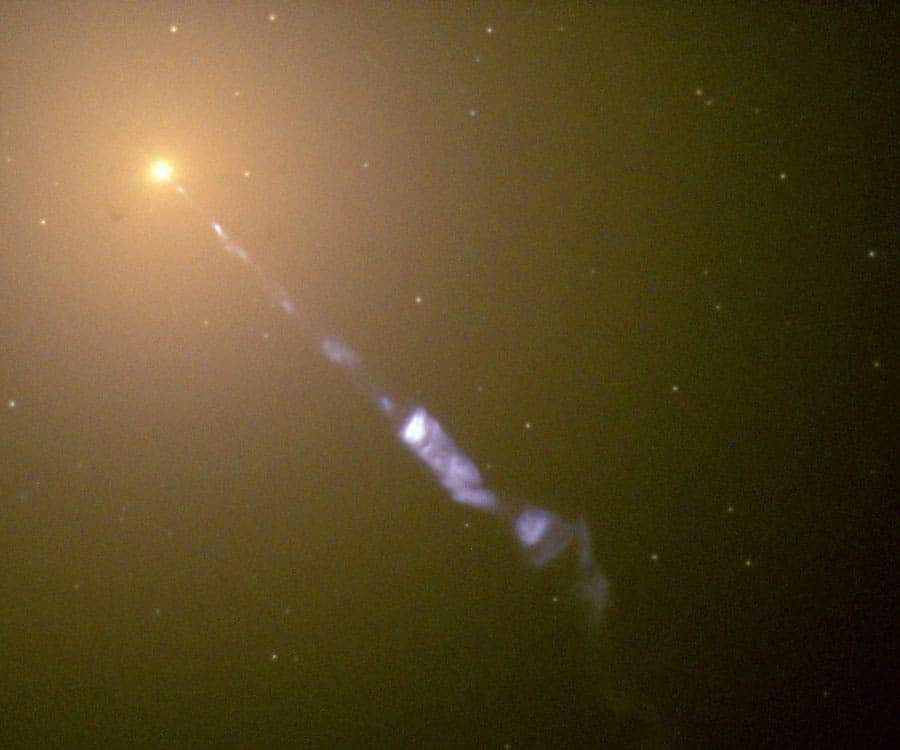 m87jet_hst_900 A photo of a huge jet emanating from the center of the galaxy M87, taken by Hubble in 1999, back when there were still very little known about them. The faint dots of light surrounding M87's center are large ancient globular clusters of stars. (c) NASA