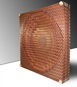 mit-metamaterial-negative-refraction-index The orientation of 4,000 S-shaped units forms a metamaterial lens that focuses radio waves with extreme precision, and very little energy lost. (c) Dylan Erb