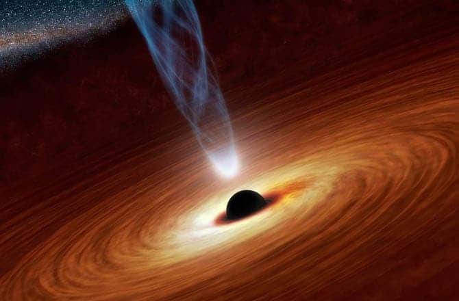 Artist's impression of a spinning supermassive black hole with a surrounding accretion disk and relativistic jets. (c) NASA/JPL