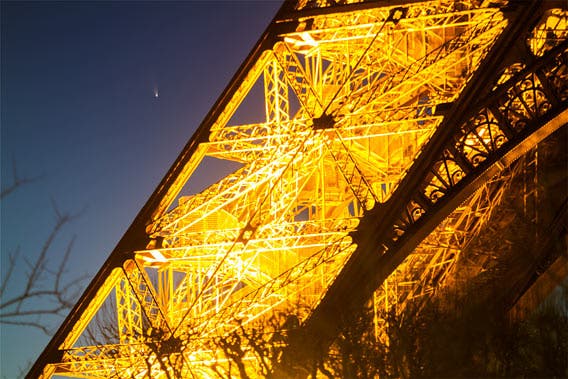 PAN-STARSS blazing through Paris' night sky in a shot that also caught the city's iconic Eiffel Tower in the foreground. (C) Jean-Luc Dauvergne