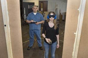 UC's Luis Favela explains a task to Mary Jean Amon during a demonstration of Favela's research experiment in the Perceptual-Motor Dynamics Lab.