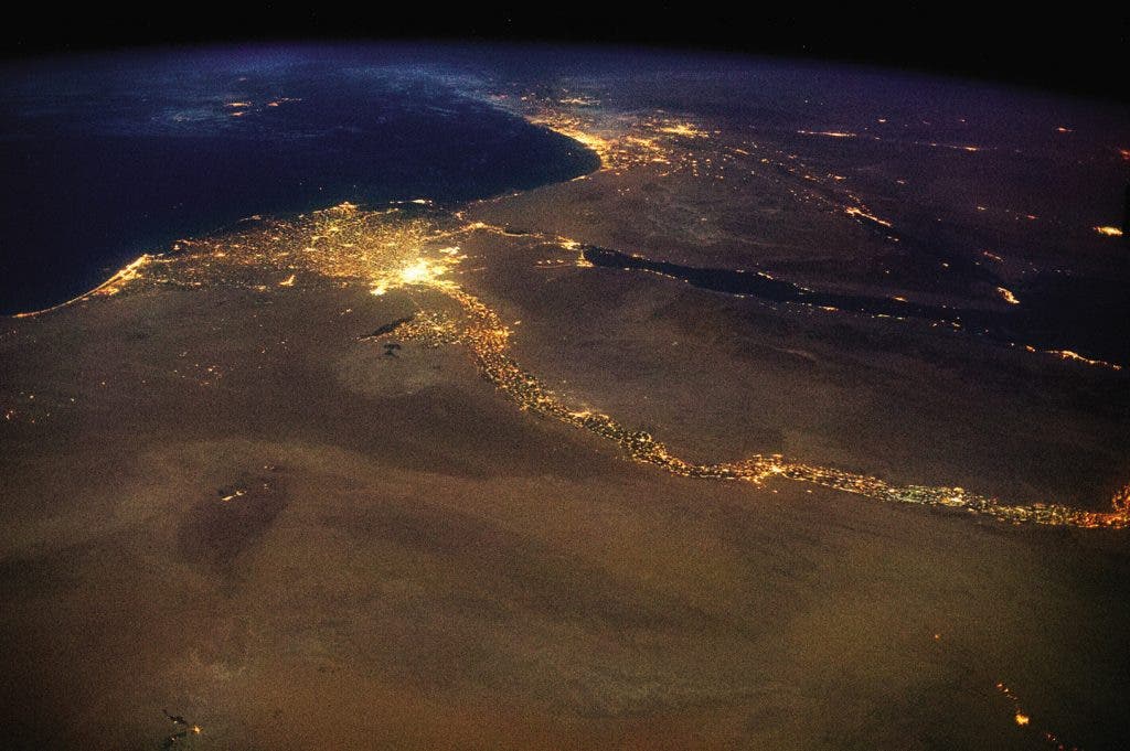 The Nile, draining out into the Mediterranean. The bright lights of Cairo announce the opening of the north-flowing river’s delta, with Jerusalem’s answering high beams to the northeast. This 4,258 mile braid of human life, first navigated end-to-end in 2004, is visible in a single glance from space.