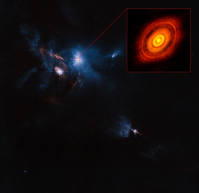 HL Tau's neighborhood, courtesy of Hubble. Image: ALMA (ESO/NAOJ/NRAO), ESA/Hubble and NASA