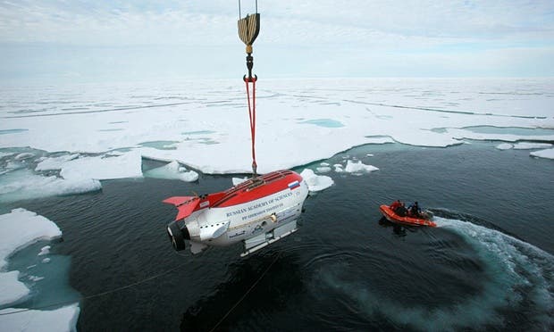 A Russian deep-diving miniature submarine is lowered from the research vessel Akademik Fyodorov moments before performing a dive in the Arctic Ocean beneath the ice at the North Pole in 2007. Photograph: Vladimir Chistyakov/AP