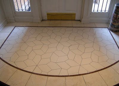 The entry foyer of the  Mathematical Association of America's building was designed using the congruent pentagons discovered by Marjorie Rice.  
