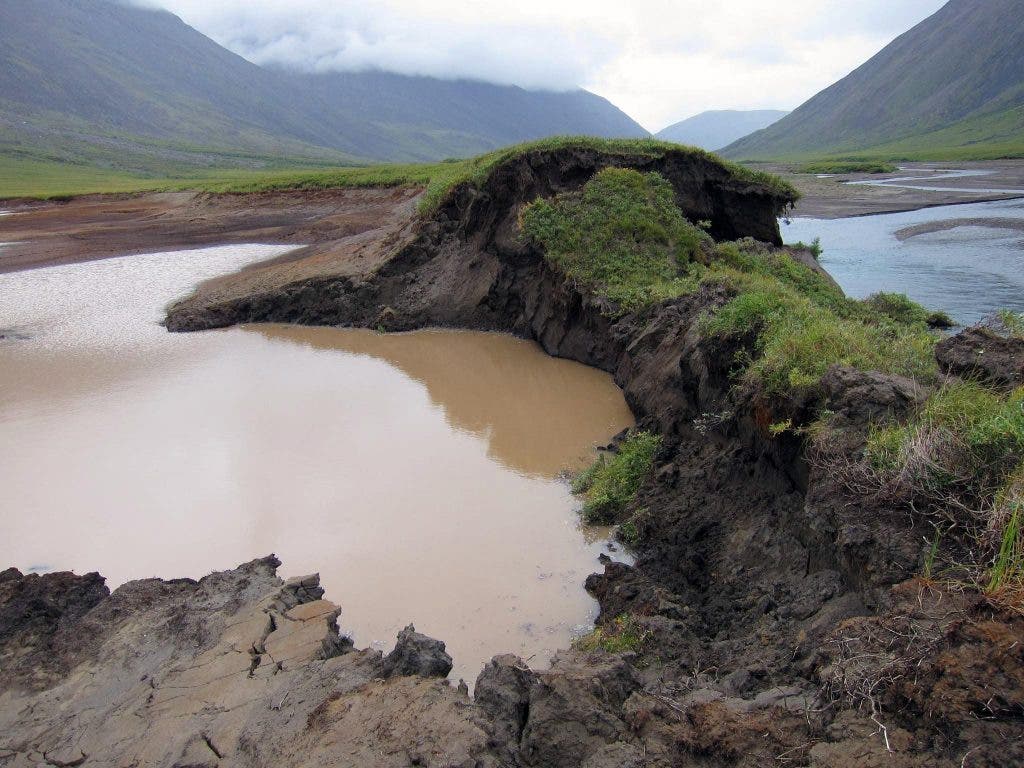 Photograph captured in Gates of the Arctic National Park, where a bank of this lake thawed, allowing the Okokmilaga River to cut through and drain it to sea. Image via flikr