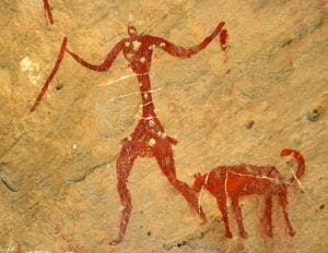Ancient cave painting showing a hunter and his dog (undated). Image: ScienceaGoGO
