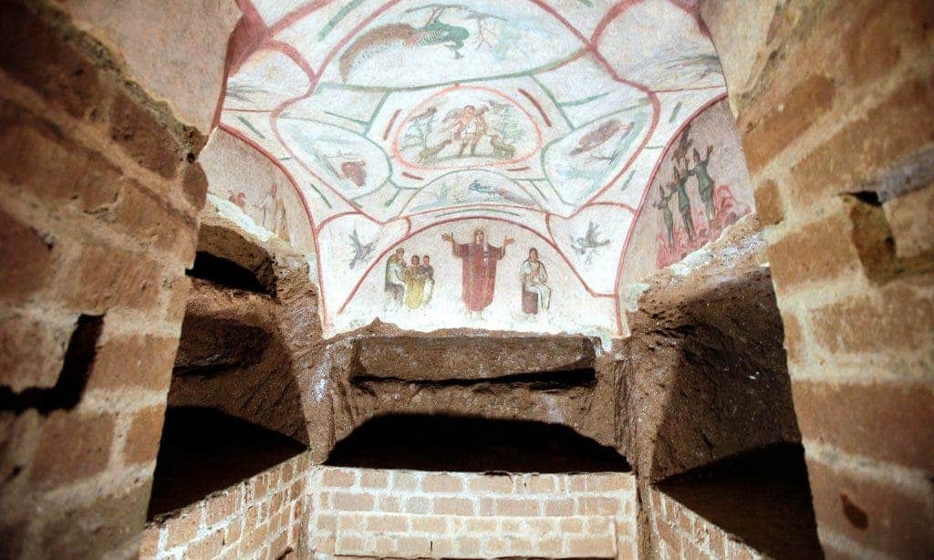 A fresco in the restored Catacombs of Priscilla, Rome. Part of a separate labyrinth of Roman tombs has been damaged by illegal dumping. Image via theguardian