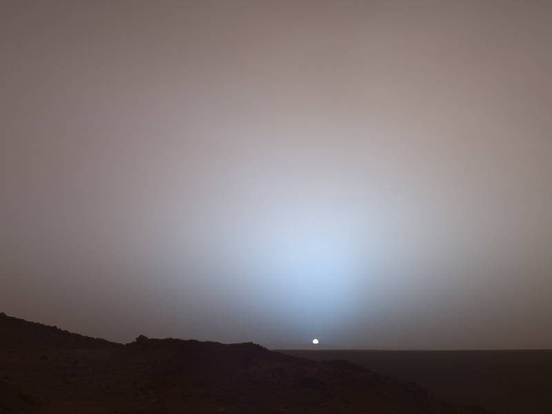 On May 19, 2005, NASA's Mars Exploration Rover Spirit captured this stunning view as the Sun sank below the rim of Gusev crater on Mars. This Panoramic Camera mosaic was taken around 6:07 in the evening of the rover's 489th Martian day, or sol. Credit: Image Credit: NASA/JPL/Texas A&M/Cornell