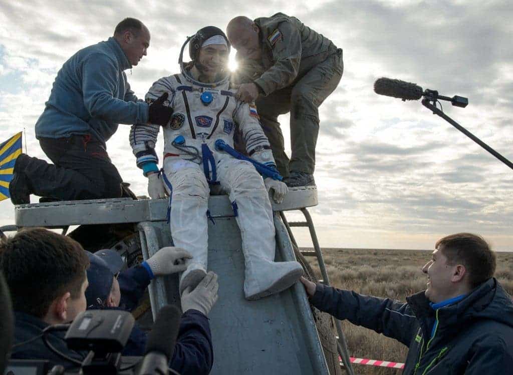 Anatoly Ivanishin exits the Soyuz spacecraft. Credit: NASA/Bill Ingalls
