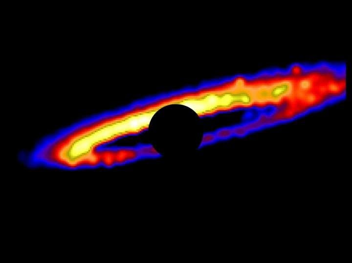 The stellar debris disk around HD 106906. This image was created using an innovative software designed at UCLA. The star itself is masked with a black circle and the various hues represent brightness gradients. Yellow is the brightest and blue the dimmest. Credit: Erika Nesvold/Carnegie Institution for Science