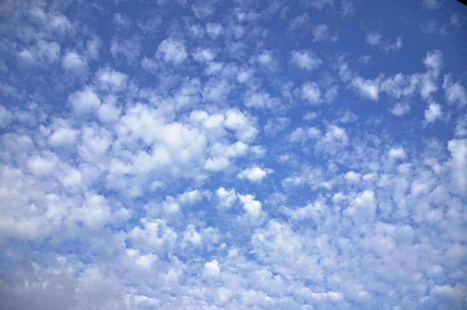 Altoculumus clouds are sometimes called 'social clouds' because they appear in groups. They have a grayish-white color with some portions darker than the others. Credit: Pixabay, MabelAmber.