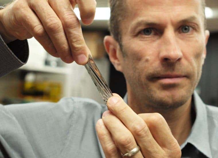 IBM scientist Dr. Mark Lantz, holds a single one square inch piece of tap, which alone can store 201 gigabytes. Credit: IBM Research.