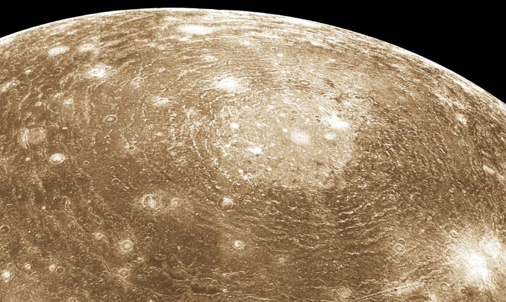 Voyager 1 image of Valhalla, a multi-ring impact structure 3800 km in diameter. Credit: Wikimedia Commons.