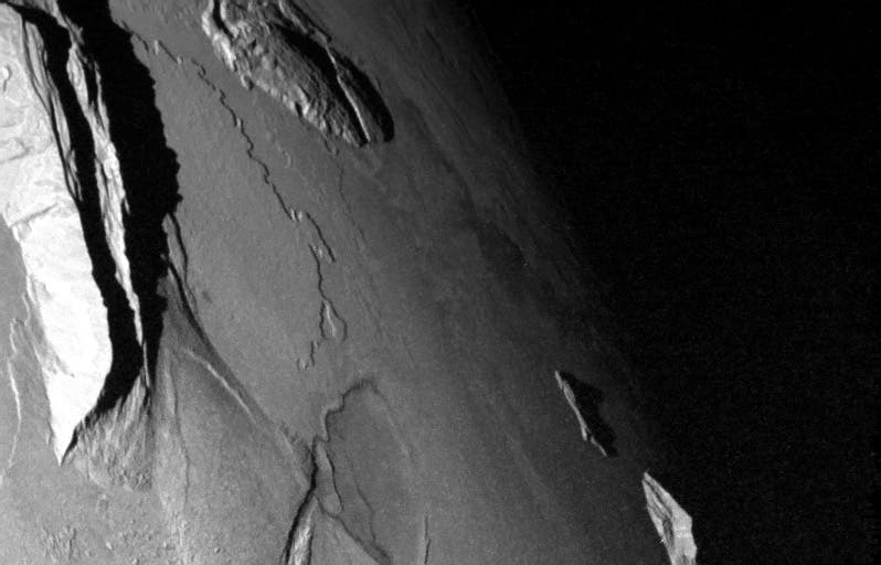 The mountain rises 8.6 kilometers, or roughly 5 miles, above the volcanic plain. Io is home to some of the highest mountains in the solar system, including some that tower 10 miles high, far higher than any mountain on Earth. Credit: NASA/JPL/University of Arizona
