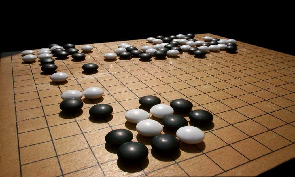 To win at Go, one of two players must surround its opponent by controlling more territory. Credit: Wikimedia Commons.