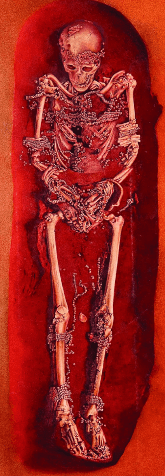 This colored photomontage shows the remains of a roughly 40-year-old man who is covered with mammoth ivory beads. Credit: Antiquity. 