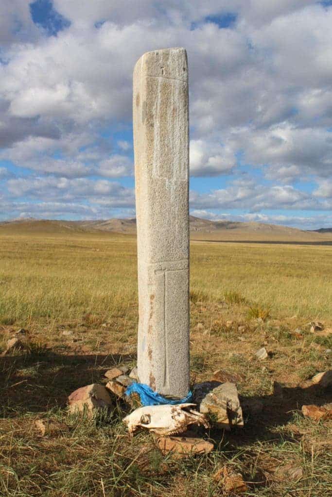 A horse skull placed next to a deer stone in central Mongolia. Ancient and modern Mongolian herders alike revere both. Credit: William Taylor.