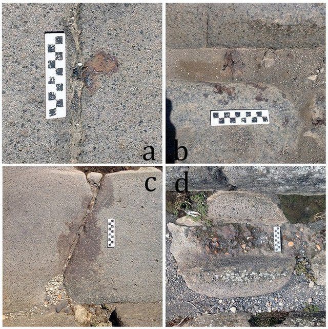 Examples of iron fillings and drops on Pomepii's ancient stone-paved streets. Credit: Eric Poehler.
