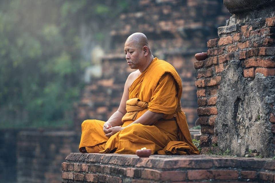 Buddhist monk meditating.