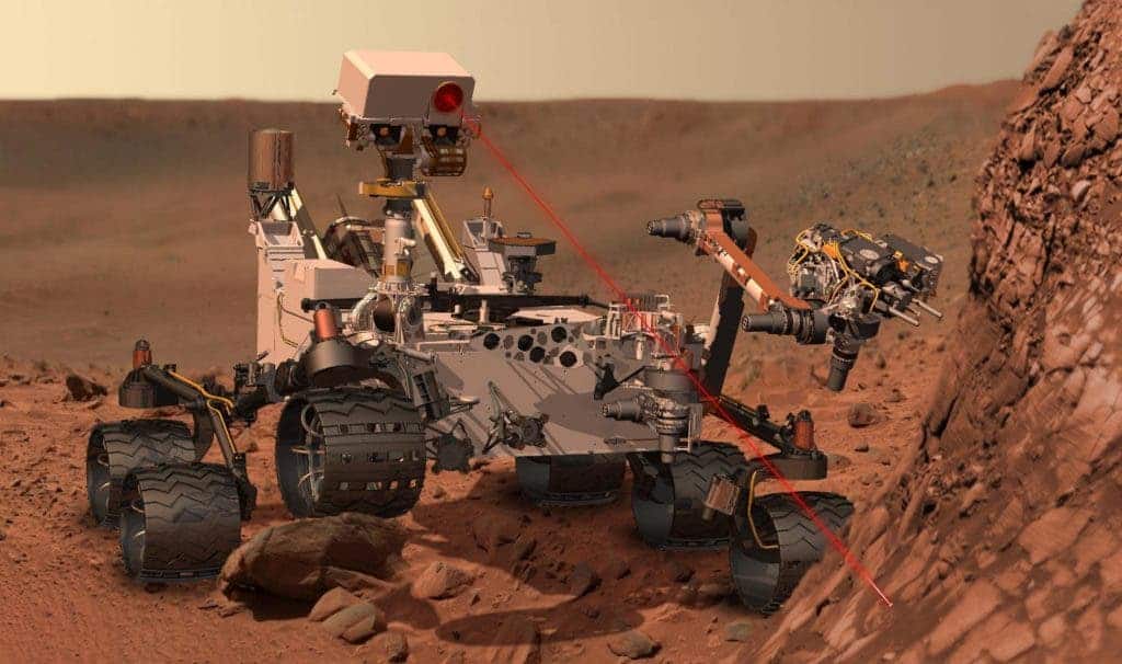 Artist's conception of the Curiosity rover vaporizing rock on Mars. The rover landed on Mars in August 2012. Credit: NASA.