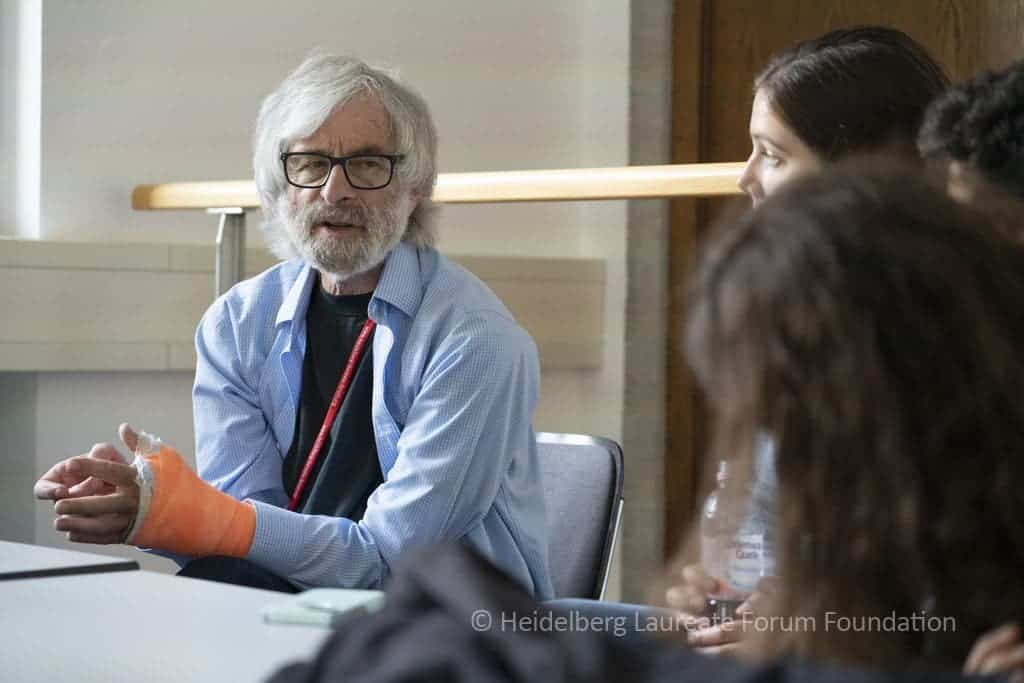 Leslie Lamport speaking to young student and researchers about the difference between coding and programming.