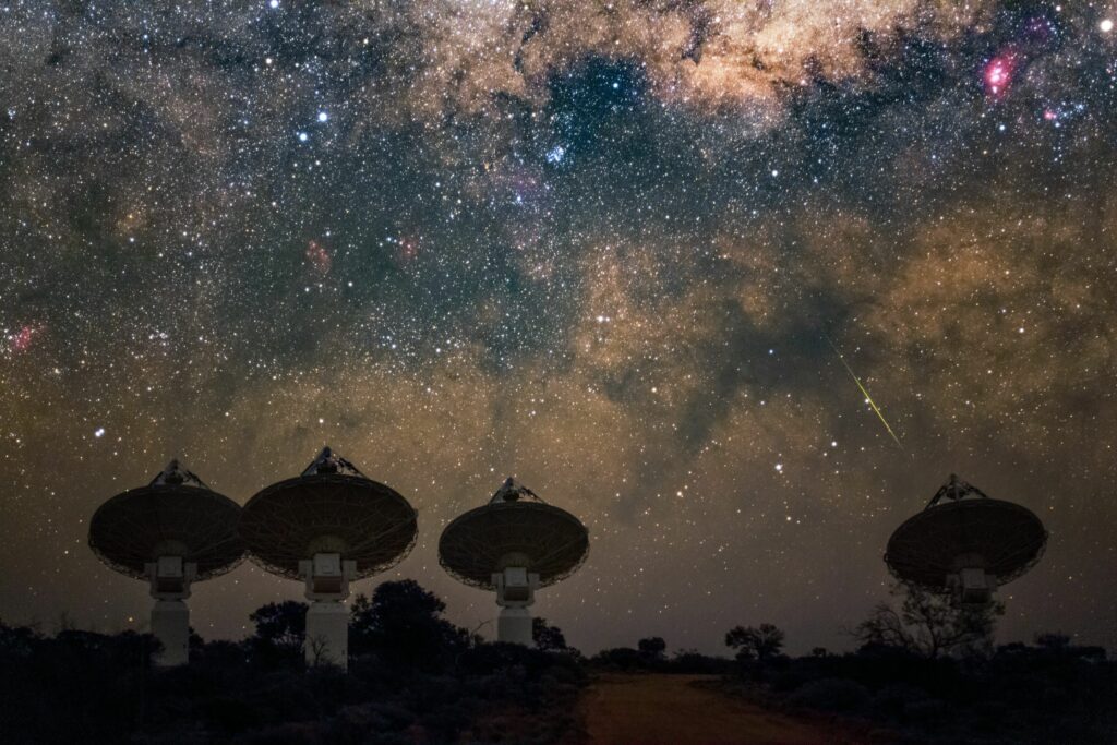 Core antennas of CSIRO’s ASKAP radio telescope in Western Australia pointing at the Milky Way. (Credit: CSIRO/ Alex Cherney)