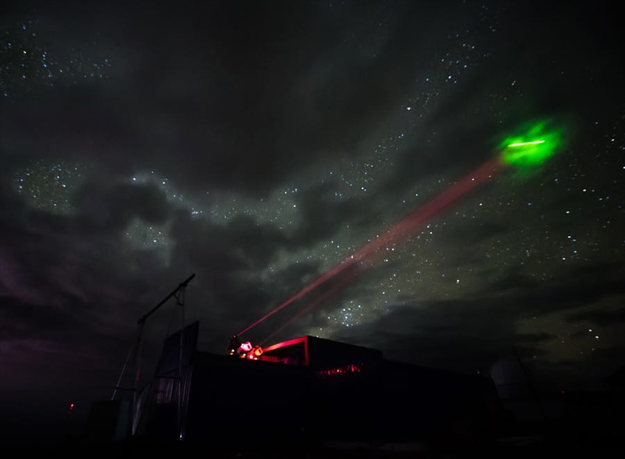 a Representation of the quantum teleport of information from the surface of Earth to space--a sci-fi's fan's dream, almost. ((IMAGE BY CAS))
