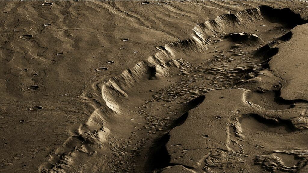 A vertically exaggerated and false-colour perspective of a large, water-carved channel on Mars called Dao Vallis. Whether channels like these on Mars were carved by surface water or groundwater is highly debated. The channel is ~40 km wide, ~2.5 km deep, and more than 500 km in length. (ESA/DLR/FU Berlin, CC BY-SA 3.0 IGO. 3D rendered and coloured by Lujendra Ojha.)