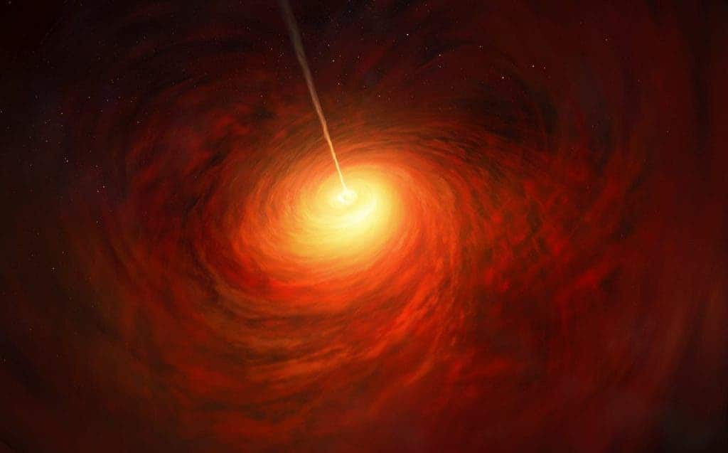 This artist’s impression depicts the black hole at the heart of the enormous elliptical galaxy Messier 87 (M87). This black hole was chosen as the object of paradigm-shifting observations by the Event Horizon Telescope. The superheated material surrounding the black hole is shown, as is the relativistic jet launched by M87’s black hole. 9ESO/M. Kornmesser)