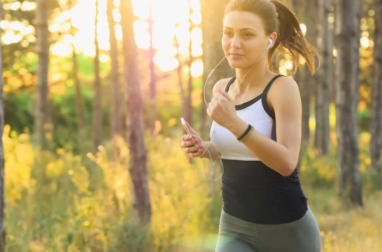 Woman running listening to music