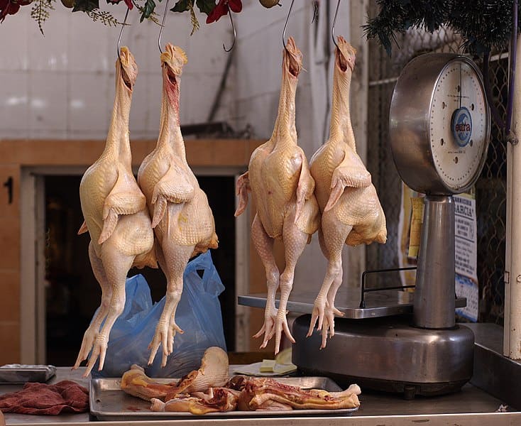 Plucked chicken meat displayed for sale at a public food market in Mazatlan, Sinaloa, Mexico.