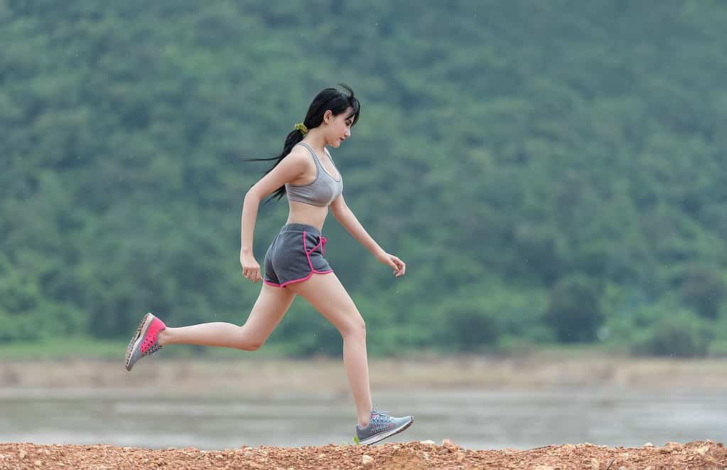 Asian woman running.